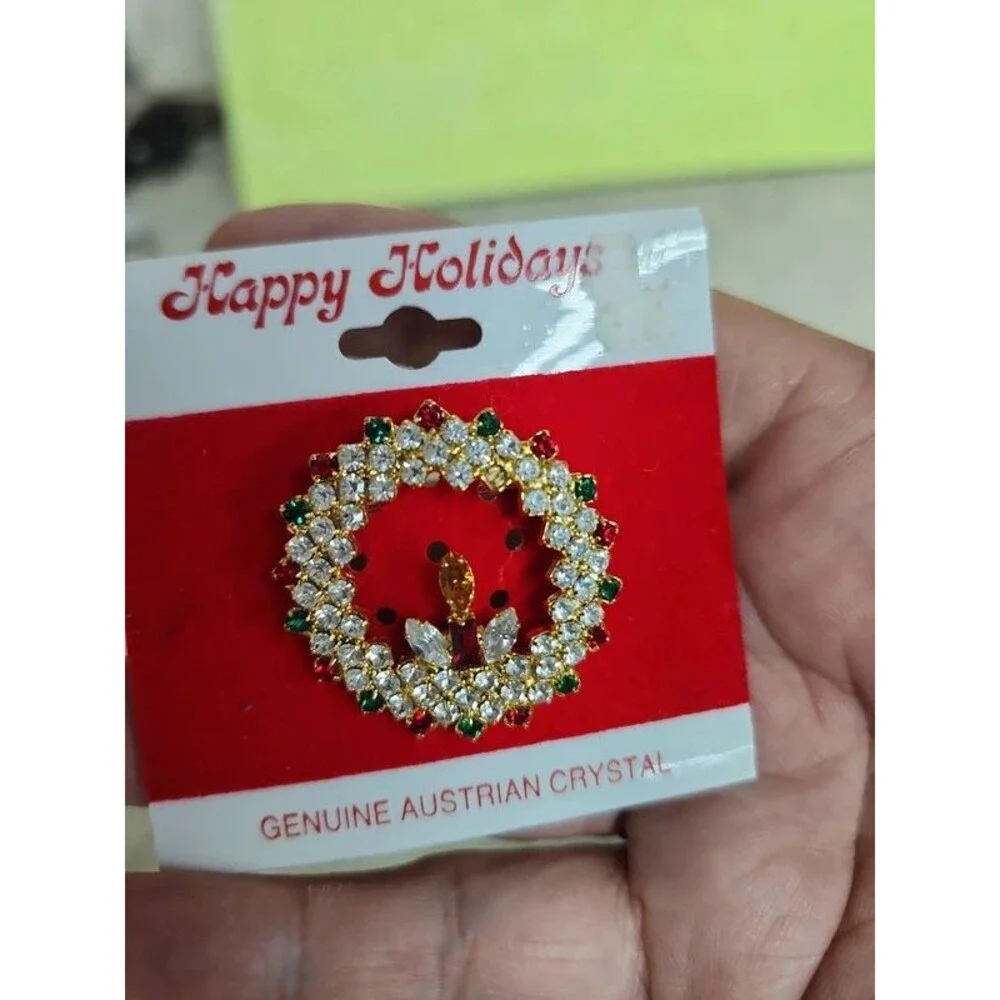 holiday wreath and candle with lots of crystals brooch